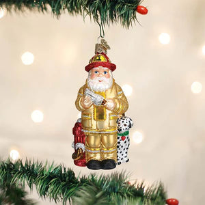 Old World brand Fireman/Firefighter with Yellow Coat, Dalmatian, and Fire Hydrant Christmas Ornament holding a Fire Hose